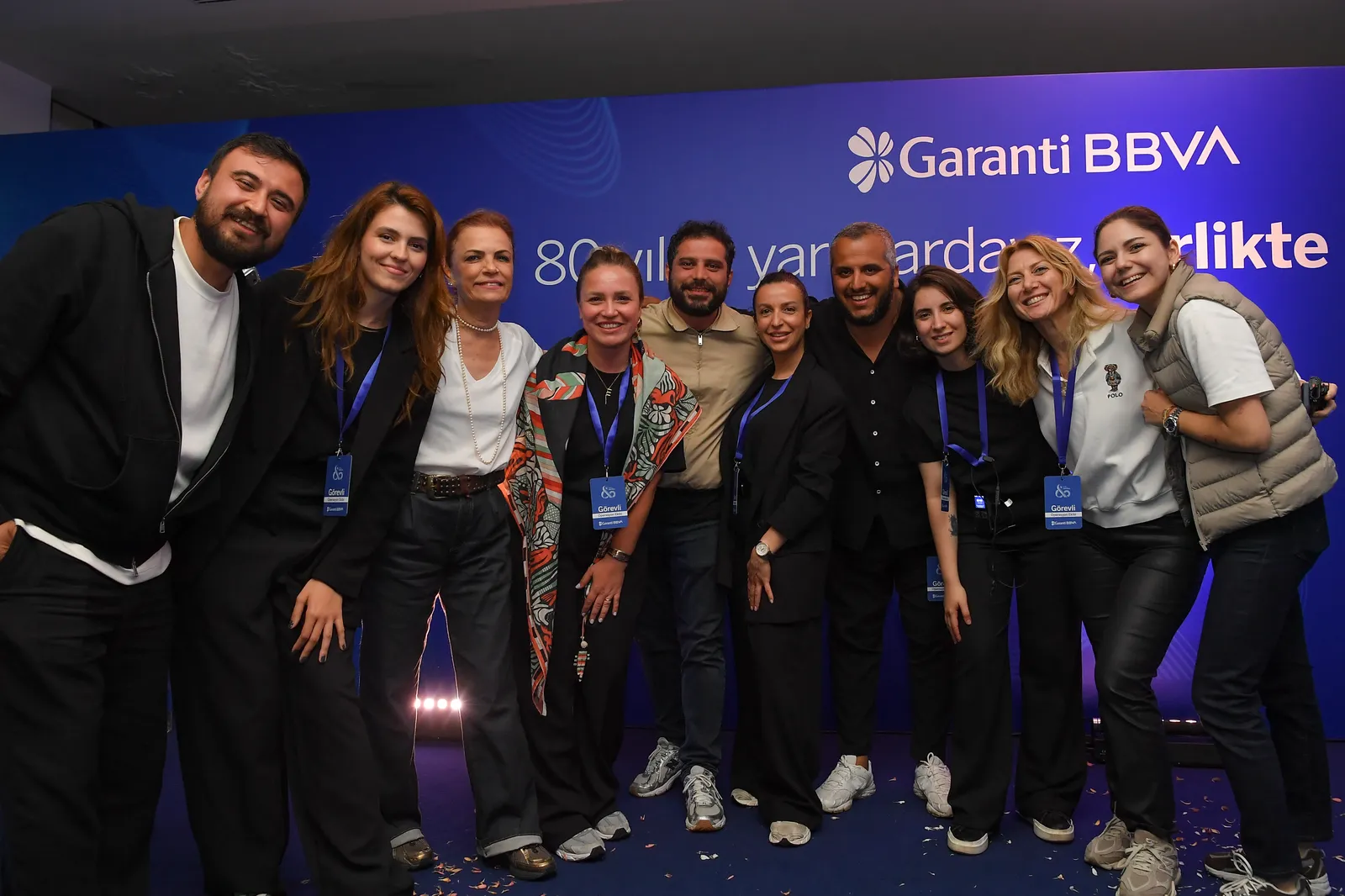 the evening of the event: team members in front of the stage